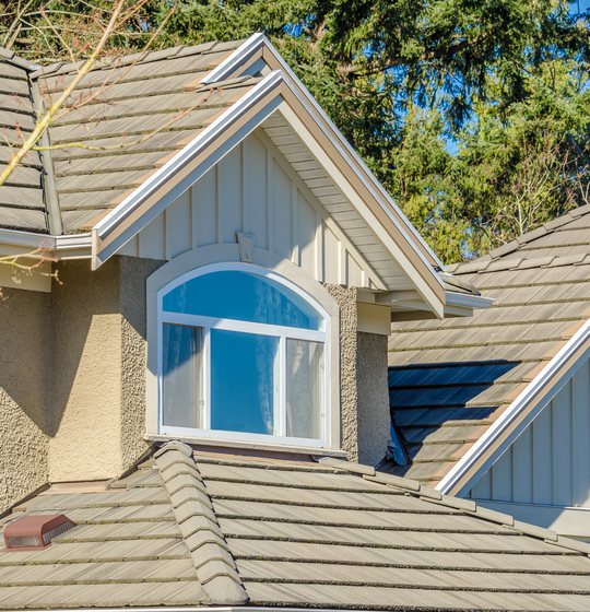 Roofers working on an Englewood, CO ranch home